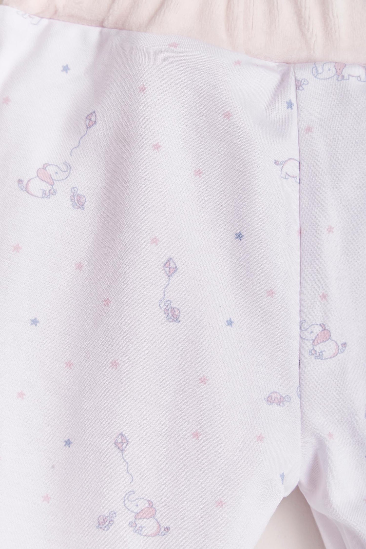 The loveliest baby boy reversible plush pants! Fully lined with Pima cotton. Elasticized waist. Perfect to match with Celine & Bernie hoodie for the ideal winter look! Colour: Pink. Composition: Outer: 85% cotton, 15% polyester. Lining: 100% Pima cotton. Made in Peru. Machine wash cold.