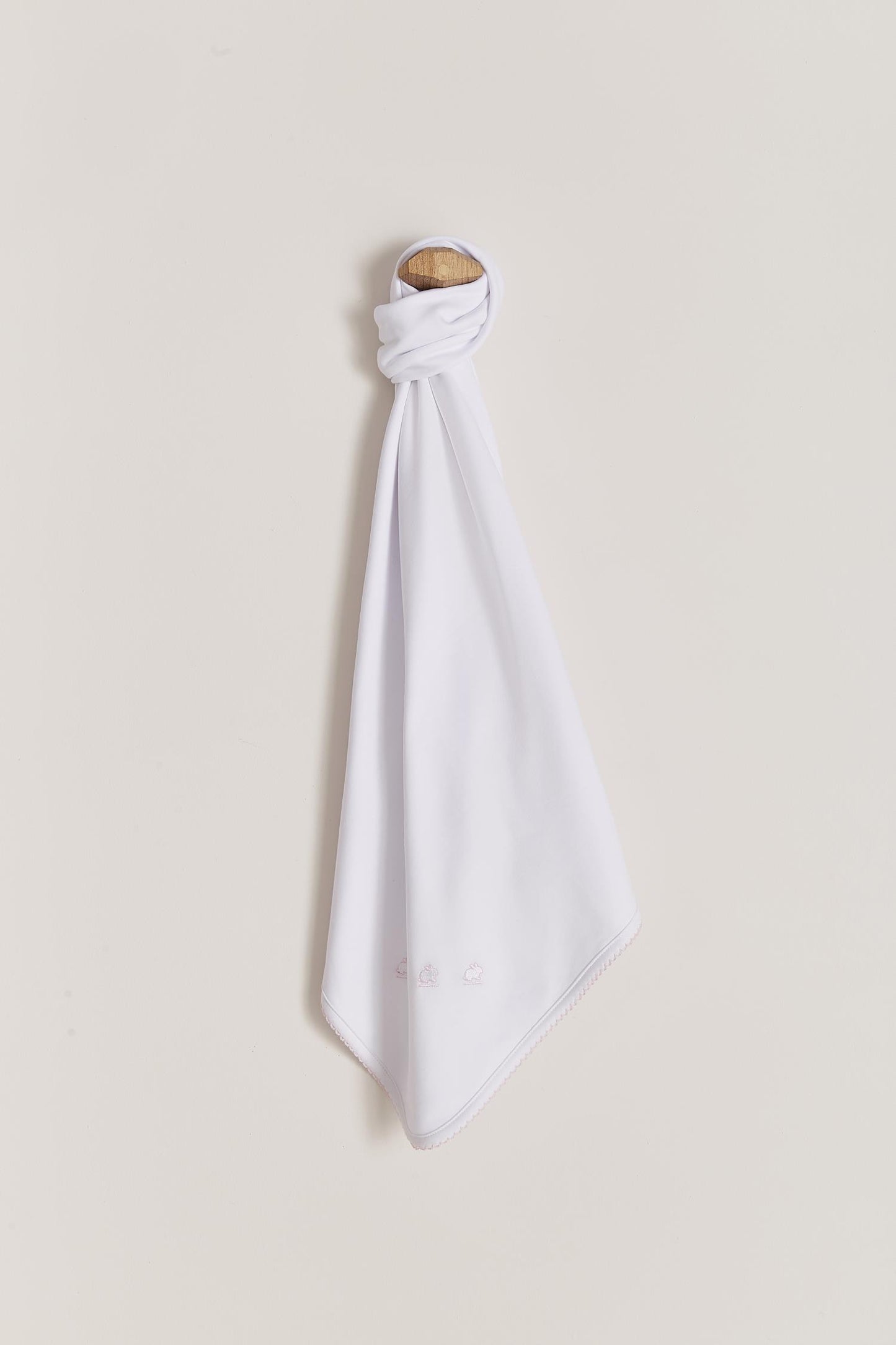 Our plain blanket in double pima cotton is pure quality and durability and whelp keeping your baby's temperature regular! Use it to lay over baby in your arms, in the pram or in the cot. It makes a great gift idea for a new baby or baby shower while combined with our softest pyjamas. Choose from a beautiful array of classic colours: light-blue and white, pink and white or all white. Features our lovely logo embroidered on one side and a delicate picot finish on the edge. Measures: 73 cm x 69 cm