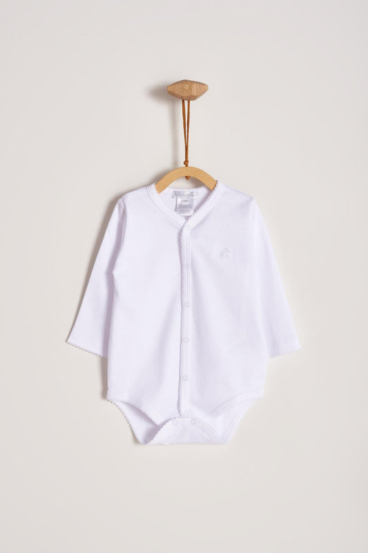 This baby basic long sleeve snapped bodysuit made with 100% super soft and resistant Pima cotton is a must have for your little one. Features a delicate embroidered neckline and sleeves alongside our sweet logo bunny. A baby's wardrobe essential! Popper fastenings around the legs and the front make changing easy, too. Colour: White. Composition: 100% Peruvian Pima Cotton.  Made in Peru.  Machine washable.