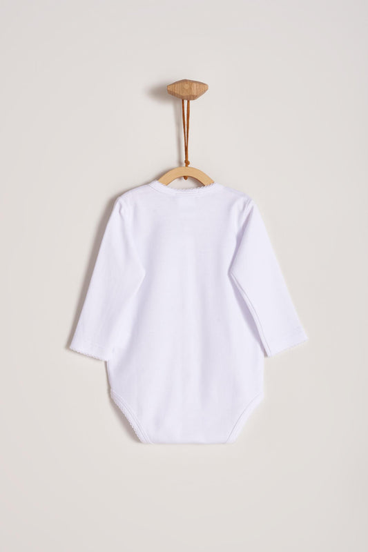 This baby basic long sleeve snapped bodysuit made with 100% super soft and resistant Pima cotton is a must have for your little one. Features a delicate embroidered neckline and sleeves alongside our sweet logo bunny. A baby's wardrobe essential! Popper fastenings around the legs and the front make changing easy, too. Colour: White. Composition: 100% Peruvian Pima Cotton.  Made in Peru.  Machine washable.
