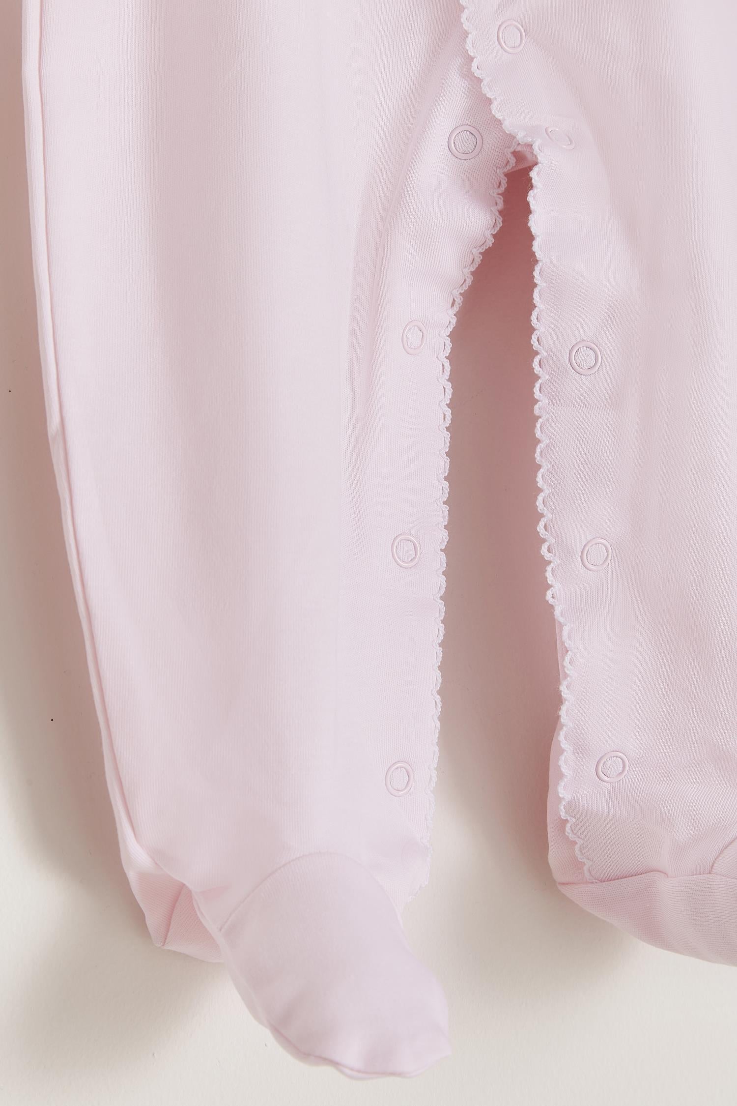 Essential footie made 100% with the softest Peruvian Pima Cotton. One of our most popular items!  Long sleeves, crew neckline and full snap opening.  Newborn footies (NB) come with reversible cuffs that help prevent scratching. Match with any of our blankets, bibs and newborn hats for the perfect gift! Colour: Light-blue Composition: 100% Peruvian Pima Cotton.  Made in Peru. Machine washable. Safety warning: Keep away from fire.