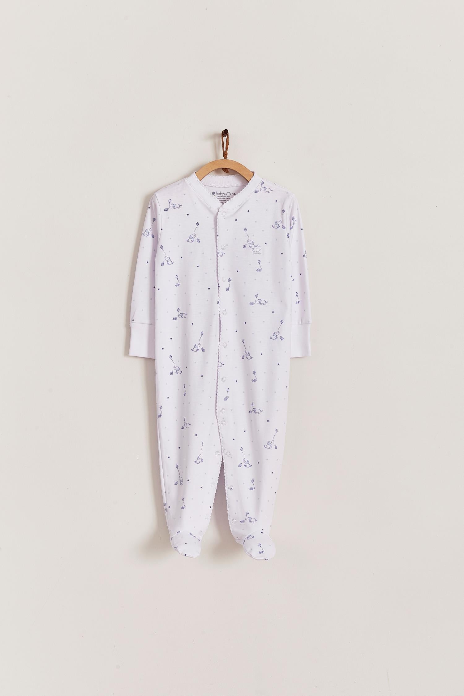 Super soft Pima cotton, long-sleeve, footed pyjama with full snap closure. The pyjama has delicate picot edging and it features our lovely Celine & Bernie print! In size NB, the cuffs give the option of making them mittens for the baby's first days, and can then be folded again. Colour: White with blue Composition: 100% Peruvian Pima Cotton.  Made in Peru. Machine washable. Safety warning: Keep away from fire.