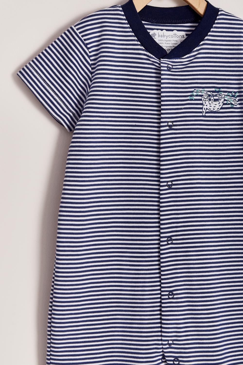 Our striped Naptime short playsuit with full snap closure make it super easy to slip on.  Very cool and fresh!  Ideal for your baby’s spring/summer wardrobe. Pair it with our Naptime bibs for the perfect look! Colour: White and blue stripes Composition: 100% Peruvian Pima Cotton.  Made in Peru. Machine washable. Safety warning: Keep away from fire.