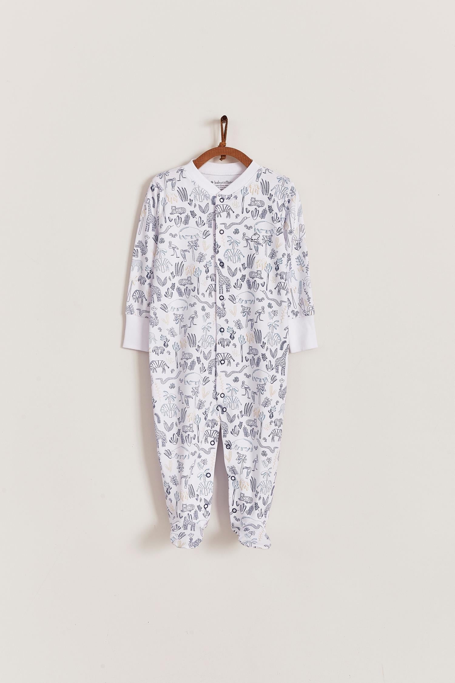 Super soft Pima cotton, long-sleeve, footed pyjama with full snap closure. The pyjama has delicate picot edging and it features an all over Safari print, very cool and fresh! Makes a lovely gift! Colour: White with blue. Composition: 100% Peruvian Pima Cotton.  Made in Peru. Machine washable. Safety warning: Keep away from fire.