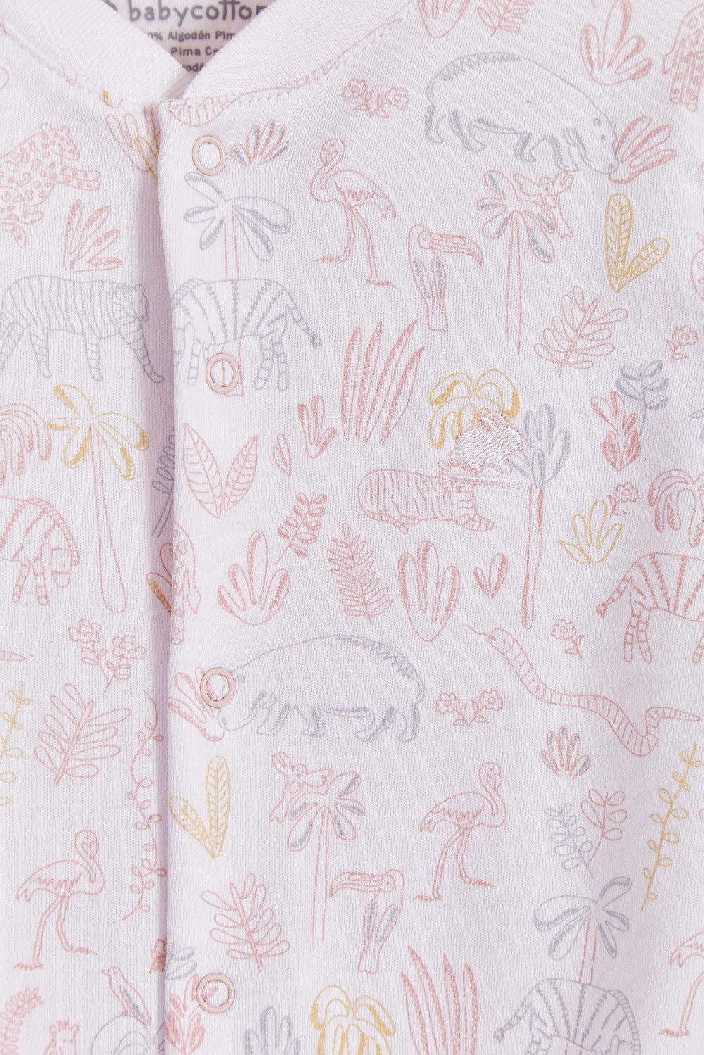 Super soft Pima cotton, long-sleeve, footed pyjama with full snap closure. The pyjama has delicate picot edging and it features an all over Safari print, very cool and fresh! In size NB, the cuffs give the option of making them mittens for the baby's first days, and can then be folded again. Colour: White with light-pink, grey and mustard. Composition: 100% Peruvian Pima Cotton.  Made in Peru. Machine washable. Safety warning: Keep away from fire.