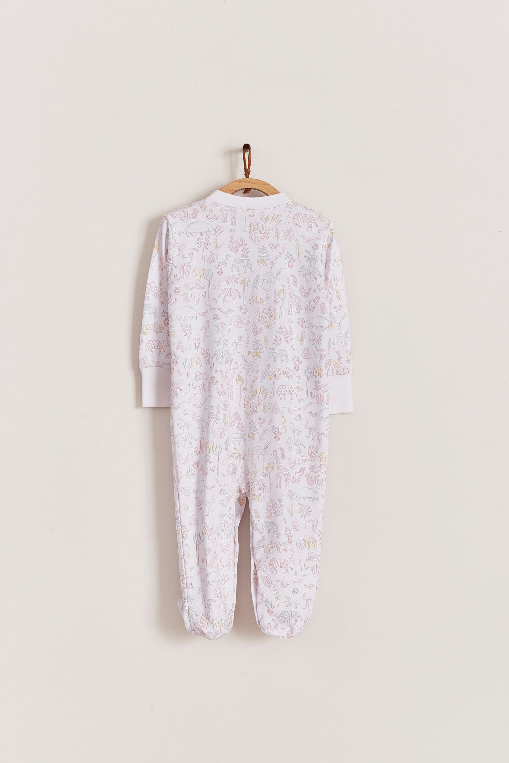 Super soft Pima cotton, long-sleeve, footed pyjama with full snap closure. The pyjama has delicate picot edging and it features an all over Safari print, very cool and fresh! In size NB, the cuffs give the option of making them mittens for the baby's first days, and can then be folded again. Colour: White with light-pink, grey and mustard. Composition: 100% Peruvian Pima Cotton.  Made in Peru. Machine washable. Safety warning: Keep away from fire.