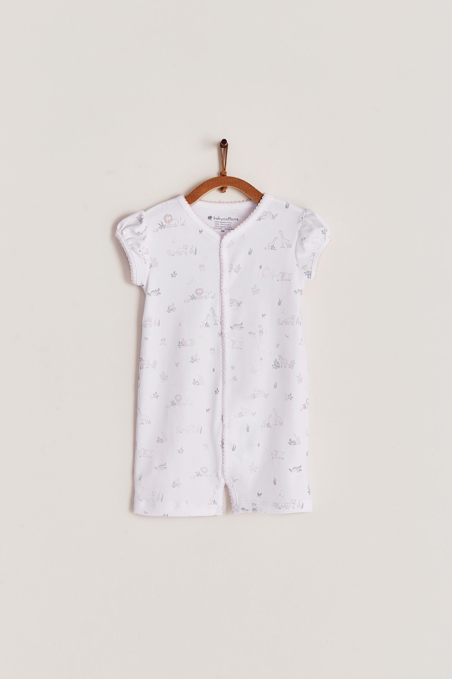 Comfy, cute and super soft, this Mini Safari short romper is the perfect addition to your baby's spring/summer wardrobe. Very versatile, the romper is perfect for playtime and nap-time! With full snap closure make it super easy to slip on. Match it with our Safari collection to make the perfect gift! Colour: White with grey and pink details. Composition: 100% Peruvian Pima Cotton.  Made in Peru. Machine washable. Safety warning: Keep away from fire.