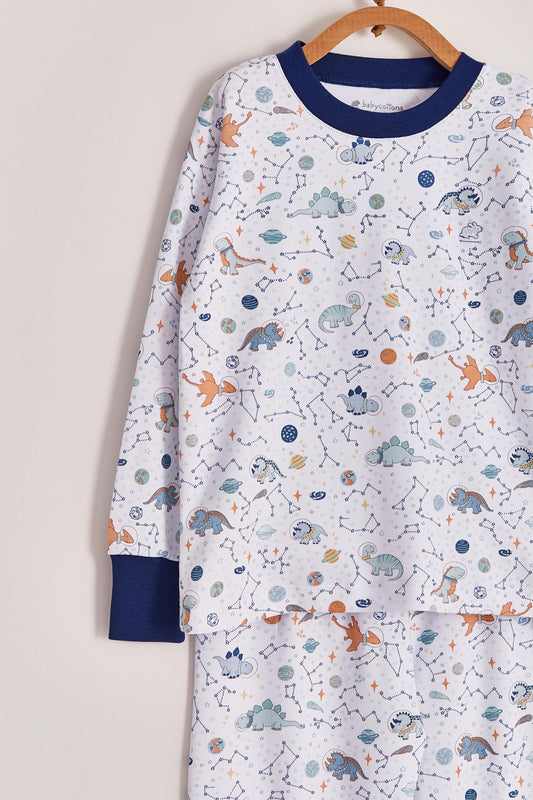 Our full print Space Dinos pyjama set is colourful, cute and fun! This 100% Pima Cotton pyjama is super soft and comfortable ideal for sleep but also playtime at home. With long-sleeves with long-pants, it's perfect for any season! Makes an ideal gift! Colour: White with blue, light-blue and orange details. Composition: 100% Peruvian Pima Cotton.  Made in Peru. Machine washable. Safety warning: Keep away from fire.