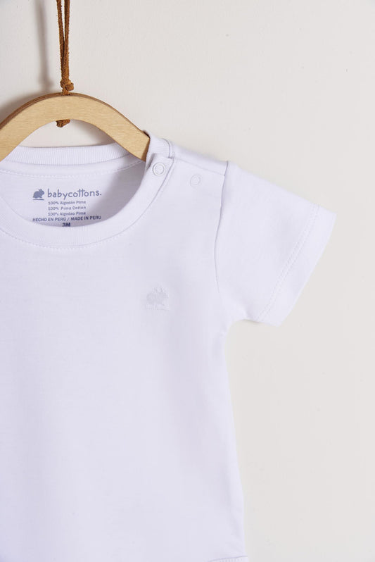 Pima cotton, long-sleeved, t-shirt collar bodysuit. Perfect for a casual look! Poppers on the shoulder and crotch: handy when getting baby dressed. A baby's wardrobe essential! Colour: White. Composition: 100% Peruvian Pima Cotton.  Made in Peru. Machine washable.