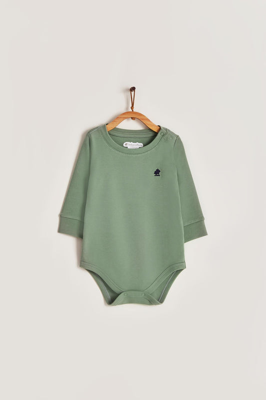 Pima cotton, long-sleeved, t-shirt collar bodysuit. Perfect for a casual look! Poppers on the shoulder and crotch: handy when getting baby dressed. A baby's wardrobe must-have available in a range of colours. Colour: Green Composition: 100% Peruvian Pima Cotton.  Machine washable (hand-wash first time is preferable but not needed) Made in Peru.