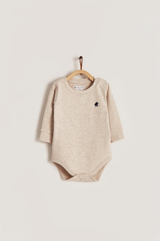 Pima cotton, long-sleeved, t-shirt collar bodysuit. Perfect for a casual look! Poppers on the shoulder and crotch: handy when getting baby dressed. A baby's wardrobe must-have available in a range of colours. Colour: Beige melange. Composition: 100% Peruvian Pima Cotton.  Made in Peru. Machine washable.
