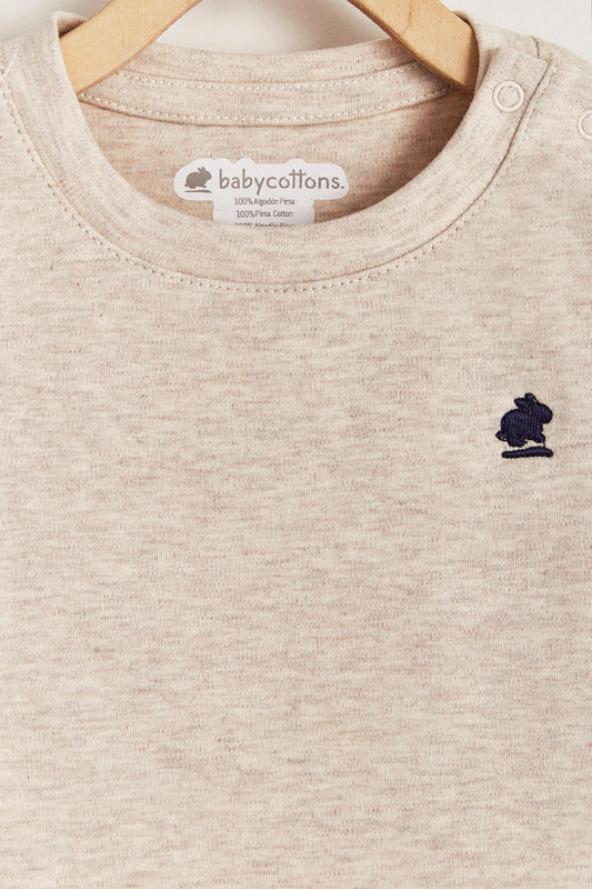 Pima cotton, long-sleeved, t-shirt collar bodysuit. Perfect for a casual look! Poppers on the shoulder and crotch: handy when getting baby dressed. A baby's wardrobe must-have available in a range of colours. Colour: Beige melange. Composition: 100% Peruvian Pima Cotton.  Made in Peru. Machine washable.