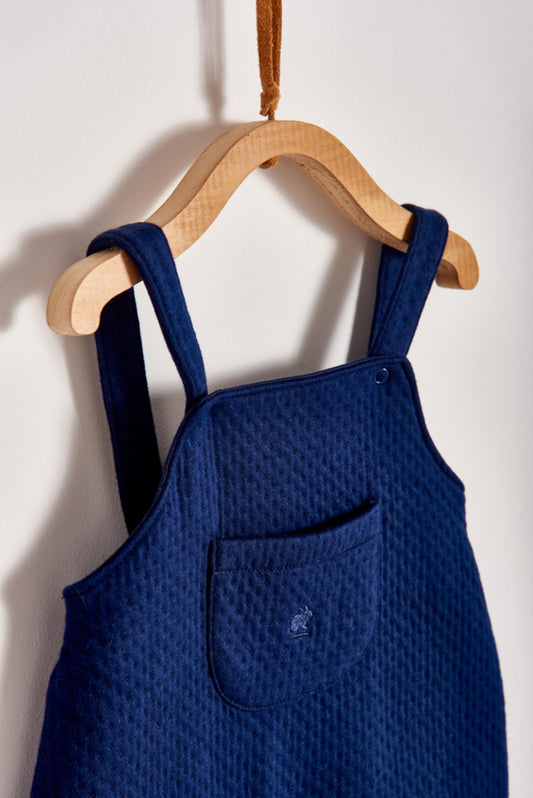 Featuring our Logo collection, this blue quilted playsuit is ideal for your baby to feel comfy and warm while having a great time exploring around!  Pair it with any of our bodysuits for the perfect weekend look! Colour: Blue Composition: 100% Peruvian Pima Cotton.  Made in Peru. Machine washable.