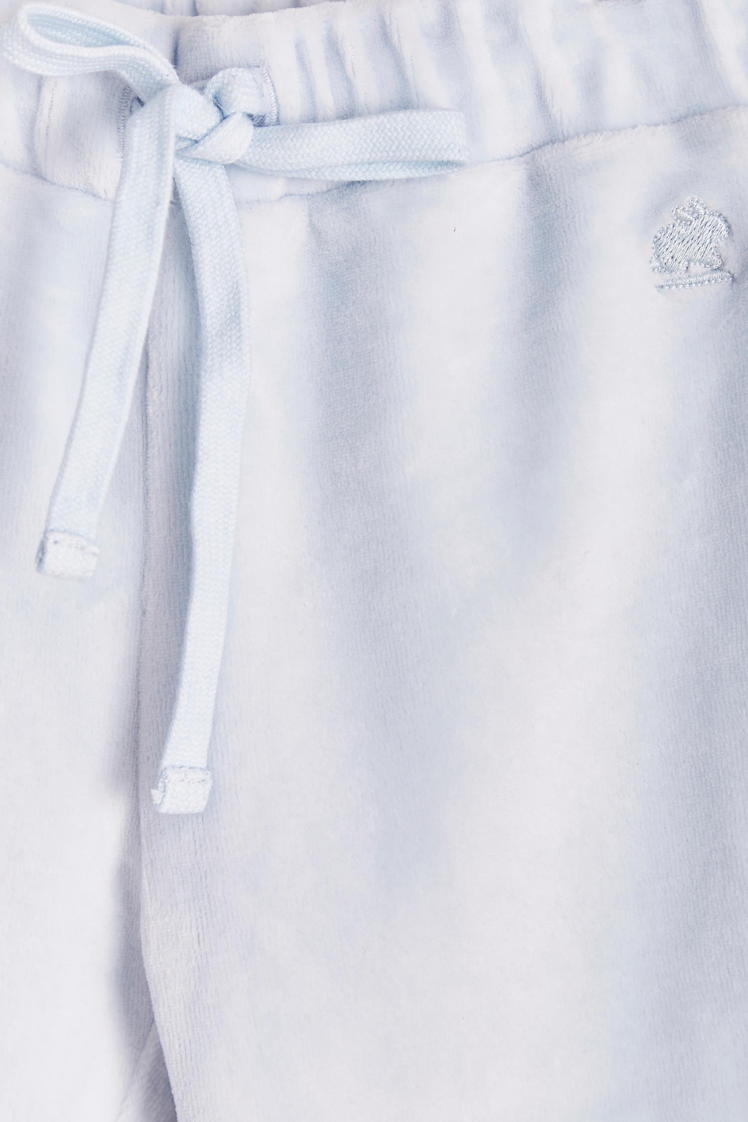 The loveliest baby boy reversible plush pants!  Fully lined with Pima cotton. Elasticized waist.  Perfect to match with Celine & Bernie hoodie.  Colour: Light-blue. Composition: Outer: 85% cotton, 15% polyester. Lining: 100% Pima cotton.  Made in Peru. Machine wash cold. 