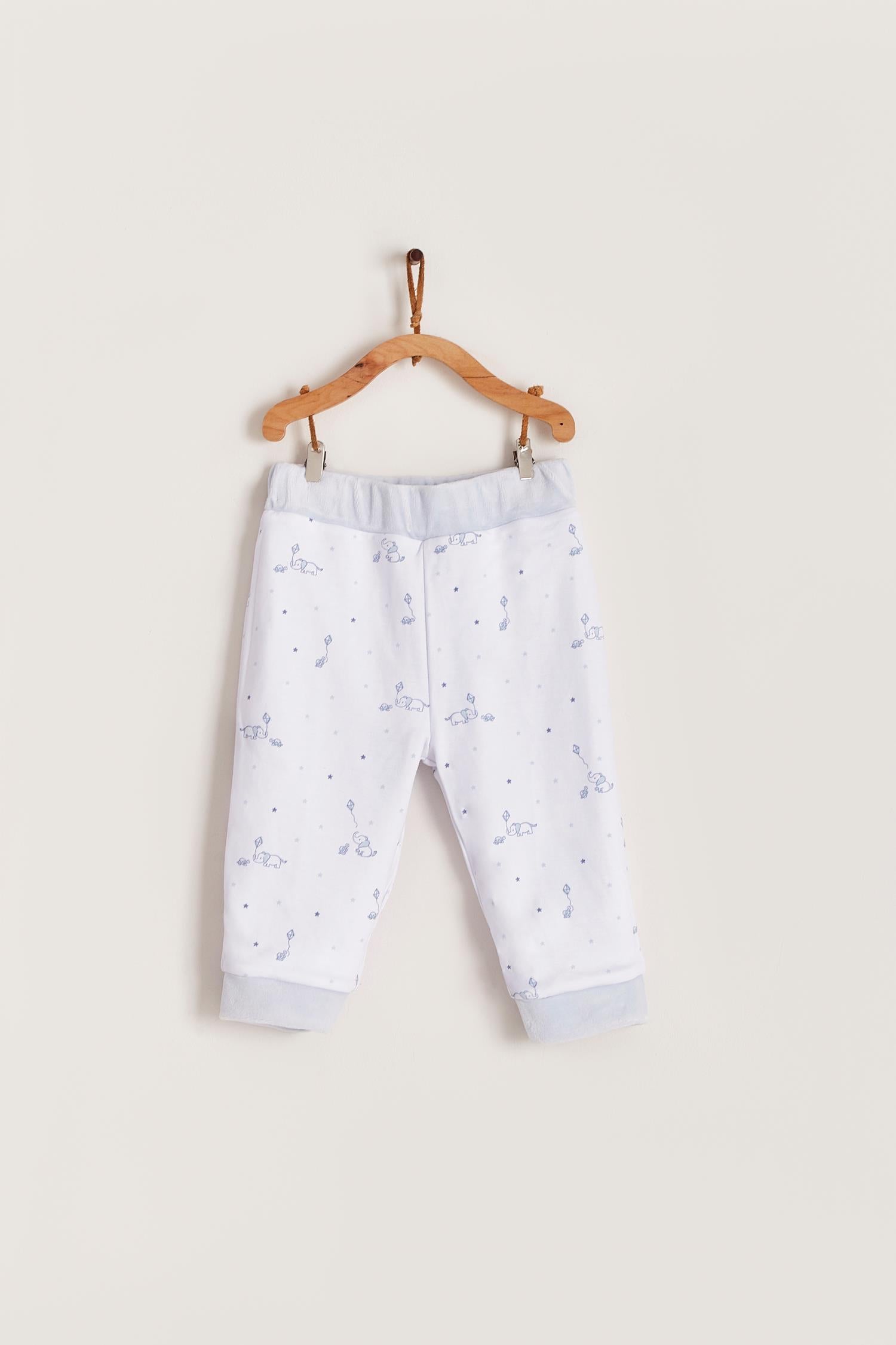 The loveliest baby boy reversible plush pants!  Fully lined with Pima cotton. Elasticized waist.  Perfect to match with Celine & Bernie hoodie.  Colour: Light-blue. Composition: Outer: 85% cotton, 15% polyester. Lining: 100% Pima cotton.  Made in Peru. Machine wash cold. 