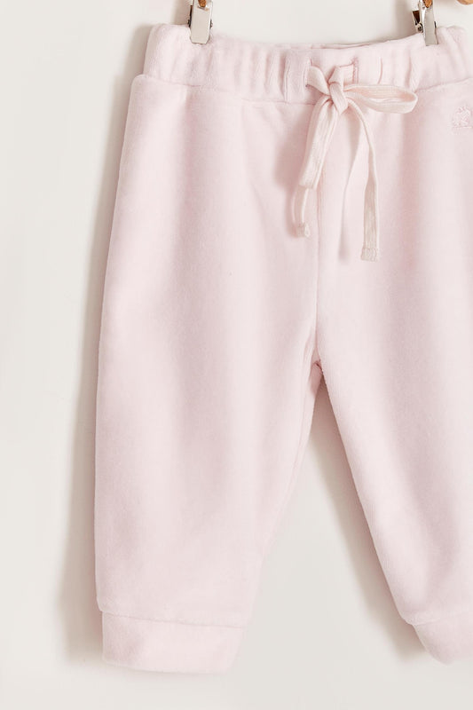 The loveliest baby boy reversible plush pants! Fully lined with Pima cotton. Elasticized waist. Perfect to match with Celine & Bernie hoodie for the ideal winter look! Colour: Pink. Composition: Outer: 85% cotton, 15% polyester. Lining: 100% Pima cotton.  Made in Peru. Machine wash cold. 