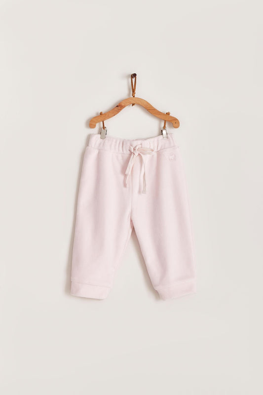 The loveliest baby boy reversible plush pants! Fully lined with Pima cotton. Elasticized waist. Perfect to match with Celine & Bernie hoodie for the ideal winter look! Colour: Pink. Composition: Outer: 85% cotton, 15% polyester. Lining: 100% Pima cotton.  Made in Peru. Machine wash cold. 