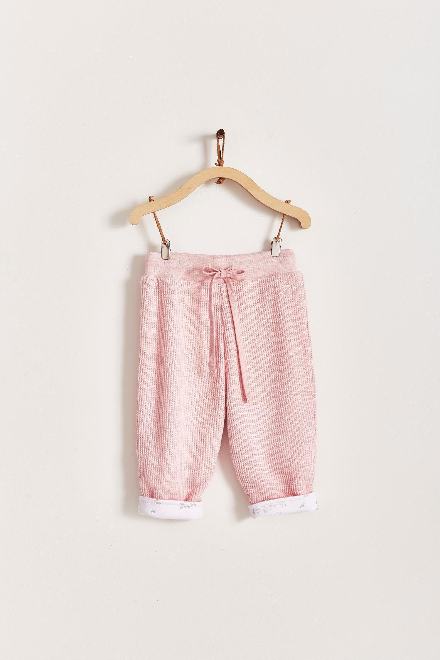 Mini Safari Waffle pants are super cute, soft and comfortable for our babies. Lined in 100% Pima cotton inside, with our beautiful Mini Safari print; outside is one-colour waffle styled.  Combine it with our mini safari waffle cardigan, and mini safari bodysuit for a complete look! Colour: Pink. Composition: 100% Peruvian Pima cotton.  Made in Peru. Machine wash cold. 