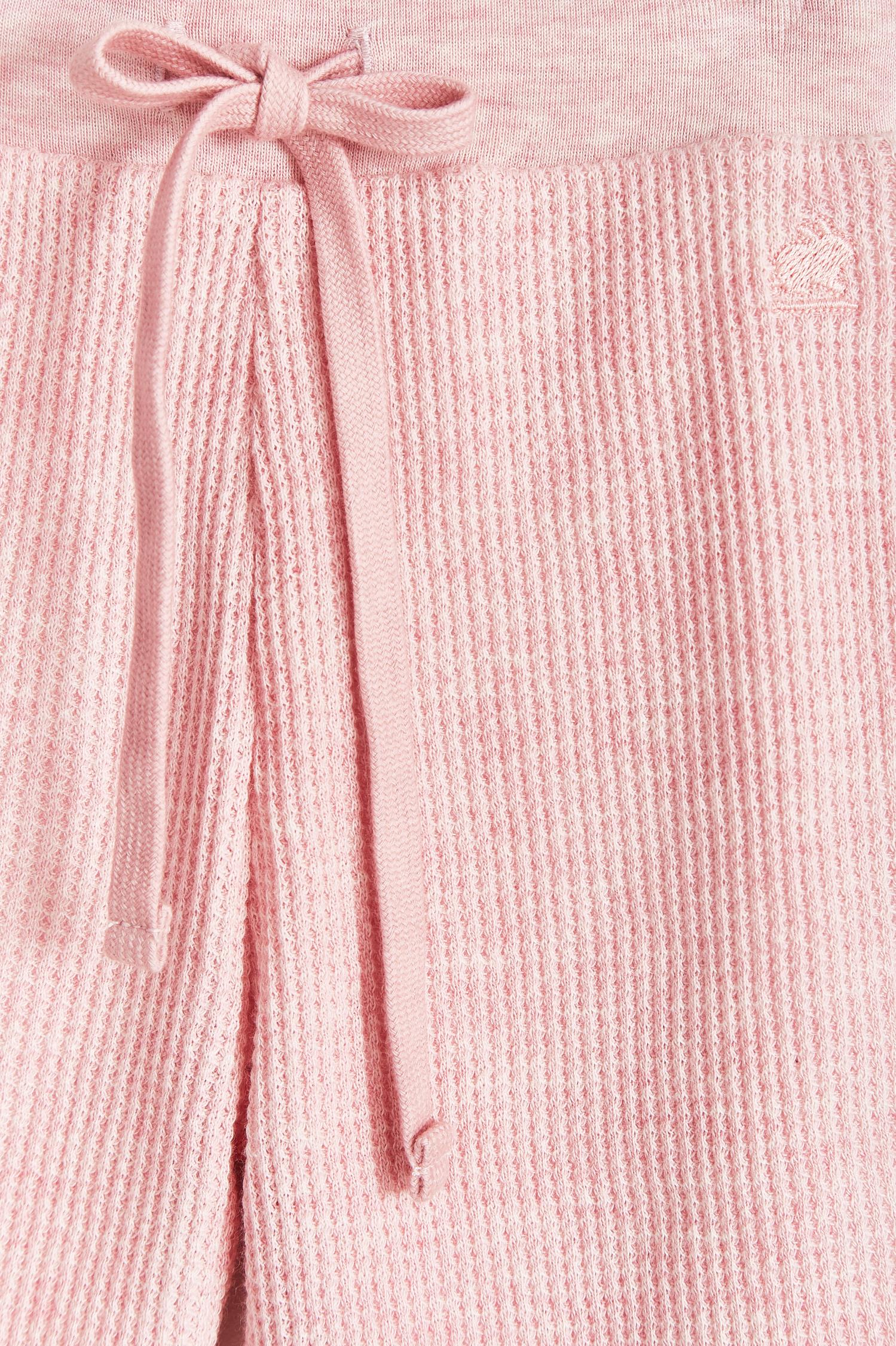 Mini Safari Waffle pants are super cute, soft and comfortable for our babies. Lined in 100% Pima cotton inside, with our beautiful Mini Safari print; outside is one-colour waffle styled.  Combine it with our mini safari waffle cardigan, and mini safari bodysuit for a complete look! Colour: Pink. Composition: 100% Peruvian Pima cotton.  Made in Peru. Machine wash cold. 