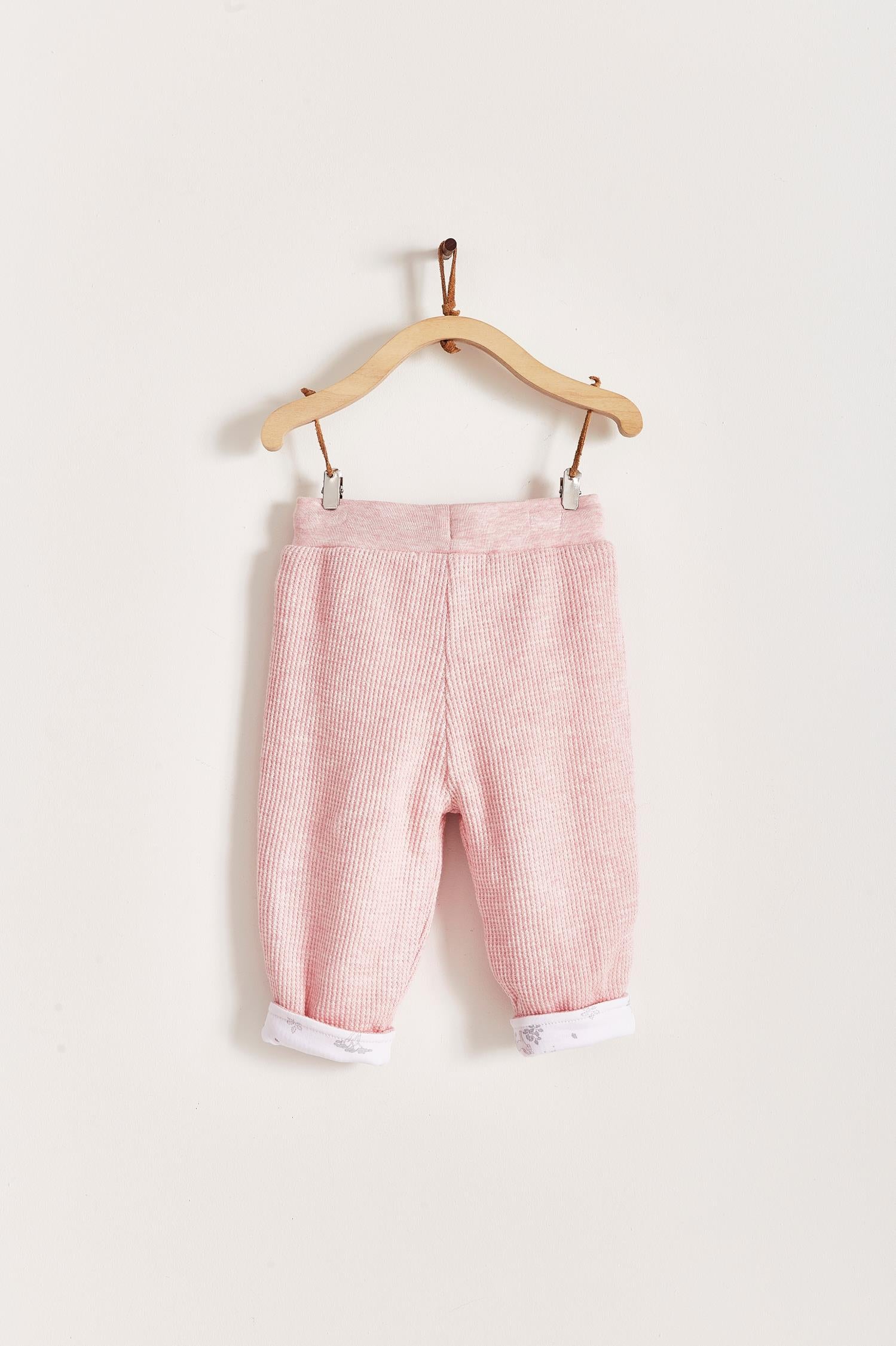 Mini Safari Waffle pants are super cute, soft and comfortable for our babies. Lined in 100% Pima cotton inside, with our beautiful Mini Safari print; outside is one-colour waffle styled.  Combine it with our mini safari waffle cardigan, and mini safari bodysuit for a complete look! Colour: Pink. Composition: 100% Peruvian Pima cotton.  Made in Peru. Machine wash cold. 