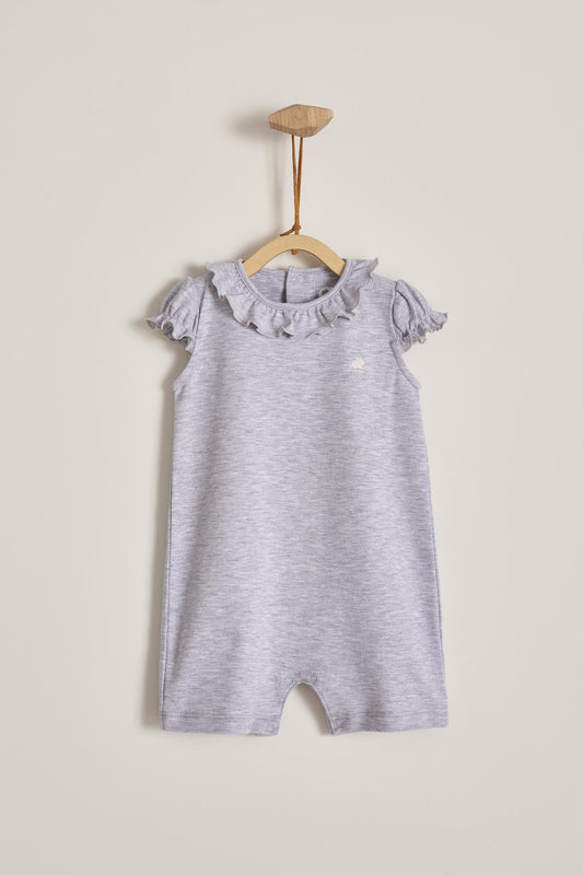 Our Pima Colours Maggie short-sleeves and short-pants romper is one of our signature baby outfits. Simply comfy and stylish, it features lovely ruffles. Ideal for your baby’s spring/summer wardrobe. Perfect for parties, playtime, or any occasion. Colour: Grey. Composition: 100% Peruvian Pima Cotton.  Made in Peru. Machine washable. Safety warning: Keep away from fire.