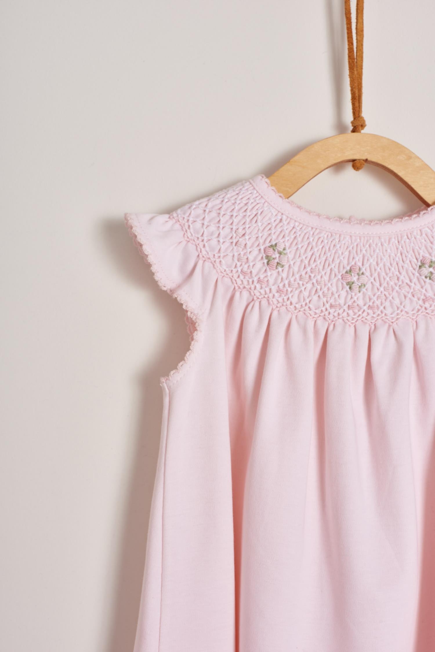 This is definitely the prettiest, effortless and softest 100% Pima Cotton dress for your little girl! The smock at the front makes it super stylish, a must-have for a baby girl spring-summer wardrobe. Comes with matching knickers to cover the nappy.  Makes an ideal gift! Colour: Pink Composition: 100% Peruvian Pima Cotton.  Made in Peru. Machine washable.