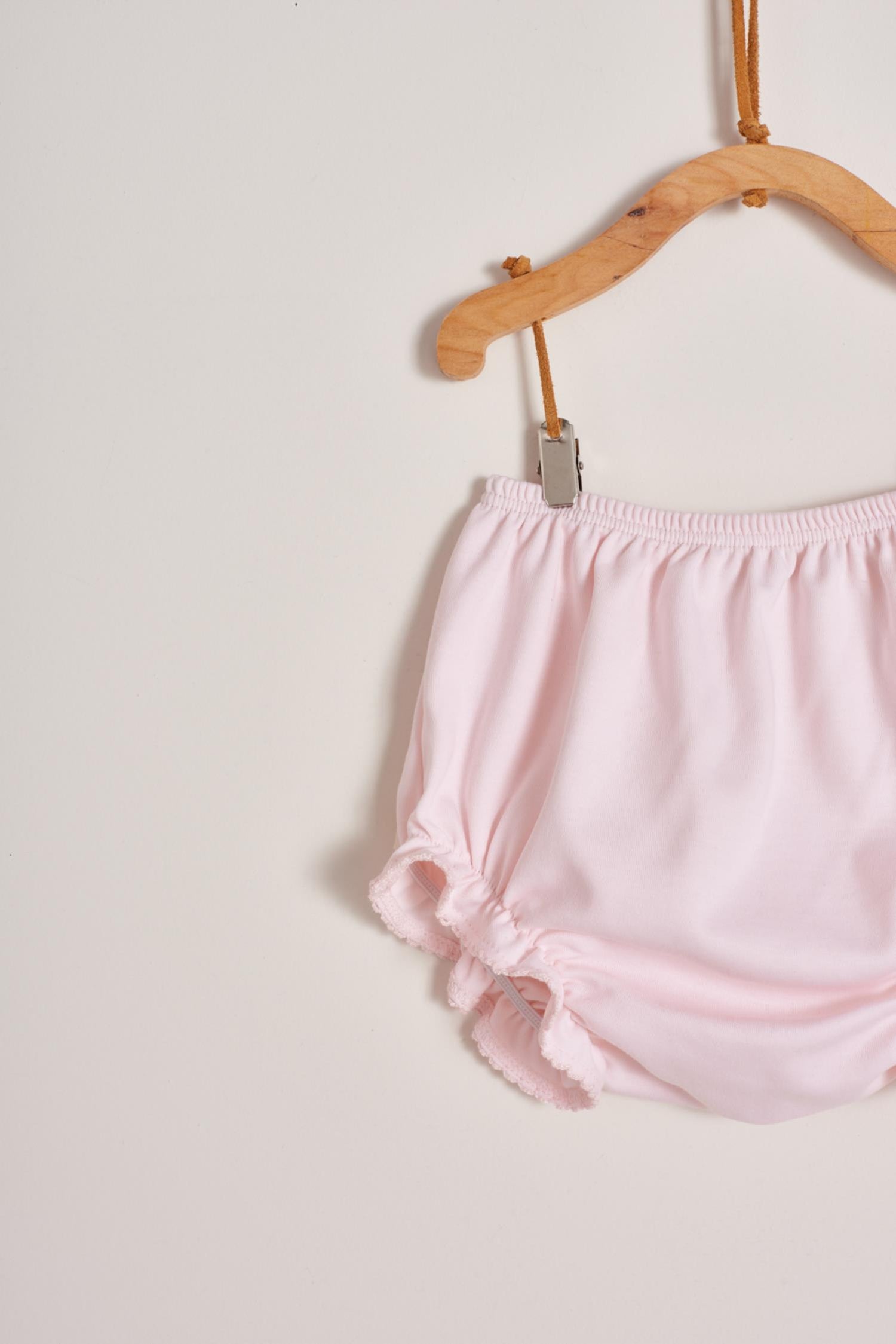 This is definitely the prettiest, effortless and softest 100% Pima Cotton dress for your little girl! The smock at the front makes it super stylish, a must-have for a baby girl spring-summer wardrobe. Comes with matching knickers to cover the nappy.  Makes an ideal gift! Colour: Pink Composition: 100% Peruvian Pima Cotton.  Made in Peru. Machine washable.