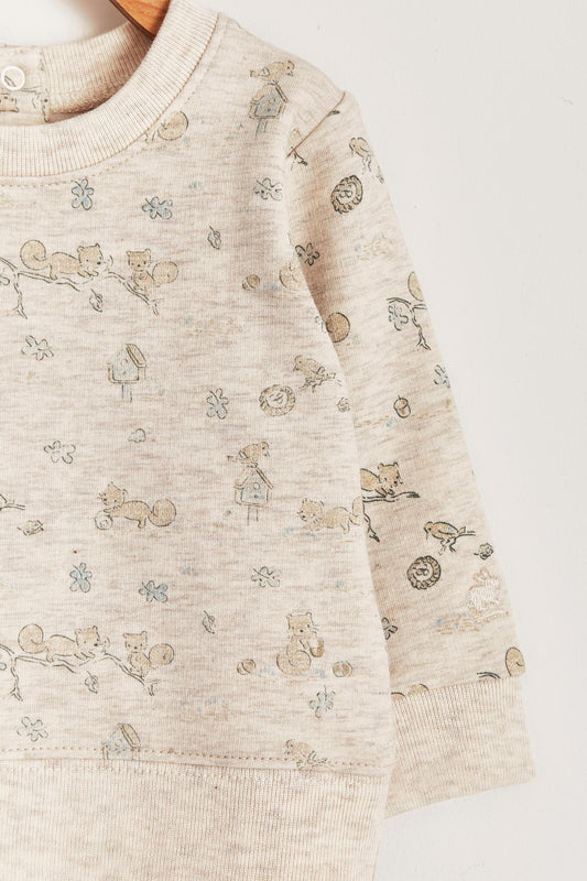 Keep your little one warm and comfortable with our baby sweatshirt, fully printed with our cute Odette Adventures collection. Round neckline and snaps closure at the back. Match it with our Odette pants for the sweetest look! Colour: Beige melange with light-brown and green details. Composition: 100% Peruvian Pima cotton.  Made in Peru. Machine wash cold. 