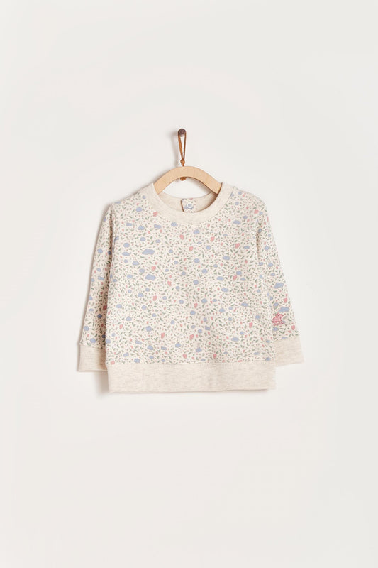Keep your little one warm and comfortable with our baby sweatshirt, fully printed with our cutest Fall in Love print. Round neckline and snaps closure at the back. Match it with our Fall in Love pants for the sweetest look! Colour: Beige melange with pink and light-blue details. Composition: 100% Peruvian Pima cotton.  Made in Peru. Machine wash cold. 