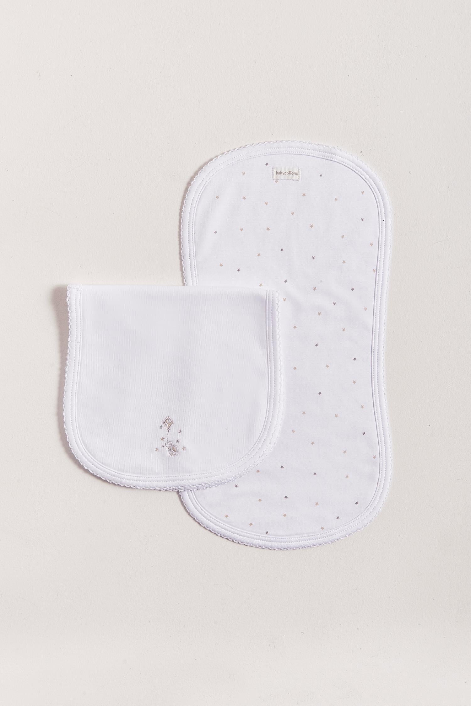 Protect your clothes after feeding with this set of two cute and ultra soft burp clothes!  Two Pima cotton burp clothes of approx. 18 cm x 36 cm, one with our Night Stars full print and the other one plain white with an embroidered turtle enjoying around the stars.  Reverse side has absorbent towel for extra comfort. This product is a MUST have! Composition: 100% Pima Cotton.  Made in Peru.  Machine washable.