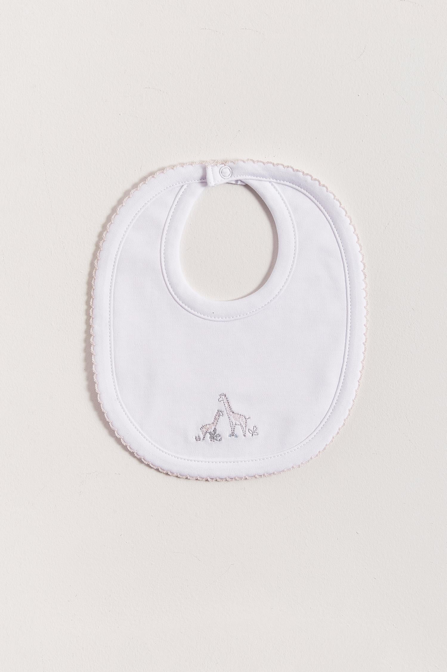 This Mini Safari bib is perfect to fit your baby from 0 to 6 months. It not only helps to keep teething baby dry and neat, but is also versatile enough for any daily outfit. Front side comes with embroidered giraffes from the collection. The reverse side has an absorbent towel for an extra comfort. Composition: 100% Peruvian Pima Cotton.  Made in Peru.  Machine washable.  