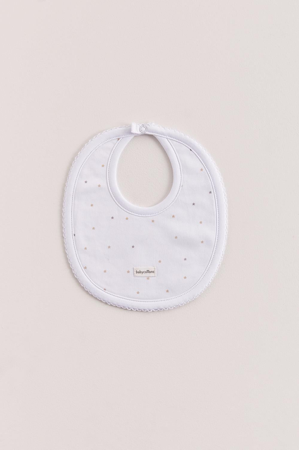 This unisex bib is perfect to fit your baby from 0 to 6 months. It not only helps to keep teething baby dry and neat, but is also versatile enough for any daily outfit. Front side comes with a full print of our Night Stars collection. The reverse side has an absorbent towel for an extra comfort. Composition: 100% Peruvian Pima Cotton.  Made in Peru.  Machine washable. 