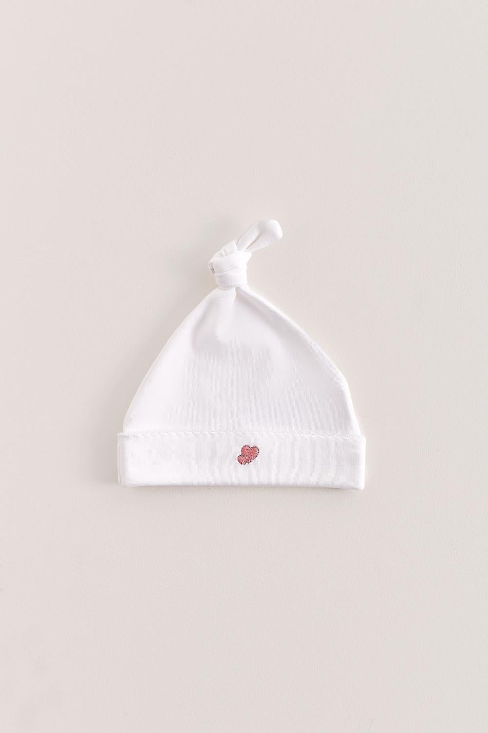 Made with the softest Pima cotton, this hat is a perfect addition to your newborn’s wardrobe.  The lightweight fitted hat will keep your little one comfy and warm.  This knot beanie features a cute print that matches perfectly with our Fall in Love collection. Composition: 100% Peruvian Pima Cotton.  Made in Peru. Machine washable.