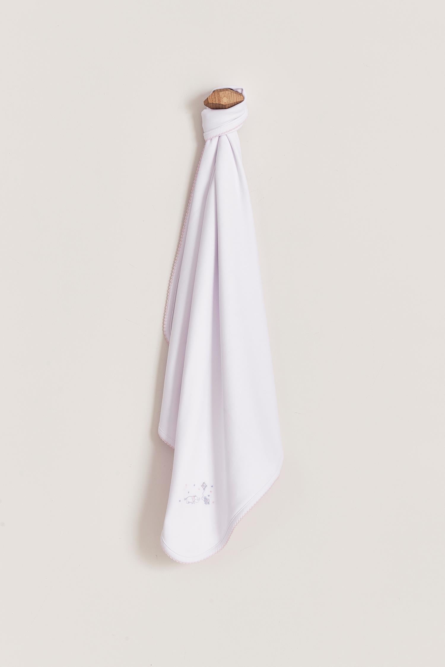 Crafted from super soft Pima cotton, this receiving blanket makes babies first months extra cozy.  This two sided blanket features a sleek white finish with an embroidered of Celine & Bernie, while the other side comes with a full print of our Celine & Bernie collection. Composition: 100% Peruvian Pima Cotton.  Made in Peru.  Machine washable. 