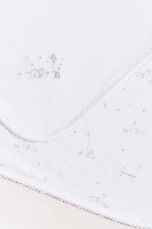 Crafted from super soft Pima cotton, this receiving blanket makes babies first months extra cozy.  This two sided blanket features a sleek white finish with an embroidered of Celine & Bernie, while the other side comes with a full print of our Celine & Bernie collection. Composition: 100% Peruvian Pima Cotton.  Made in Peru.  Machine washable. 