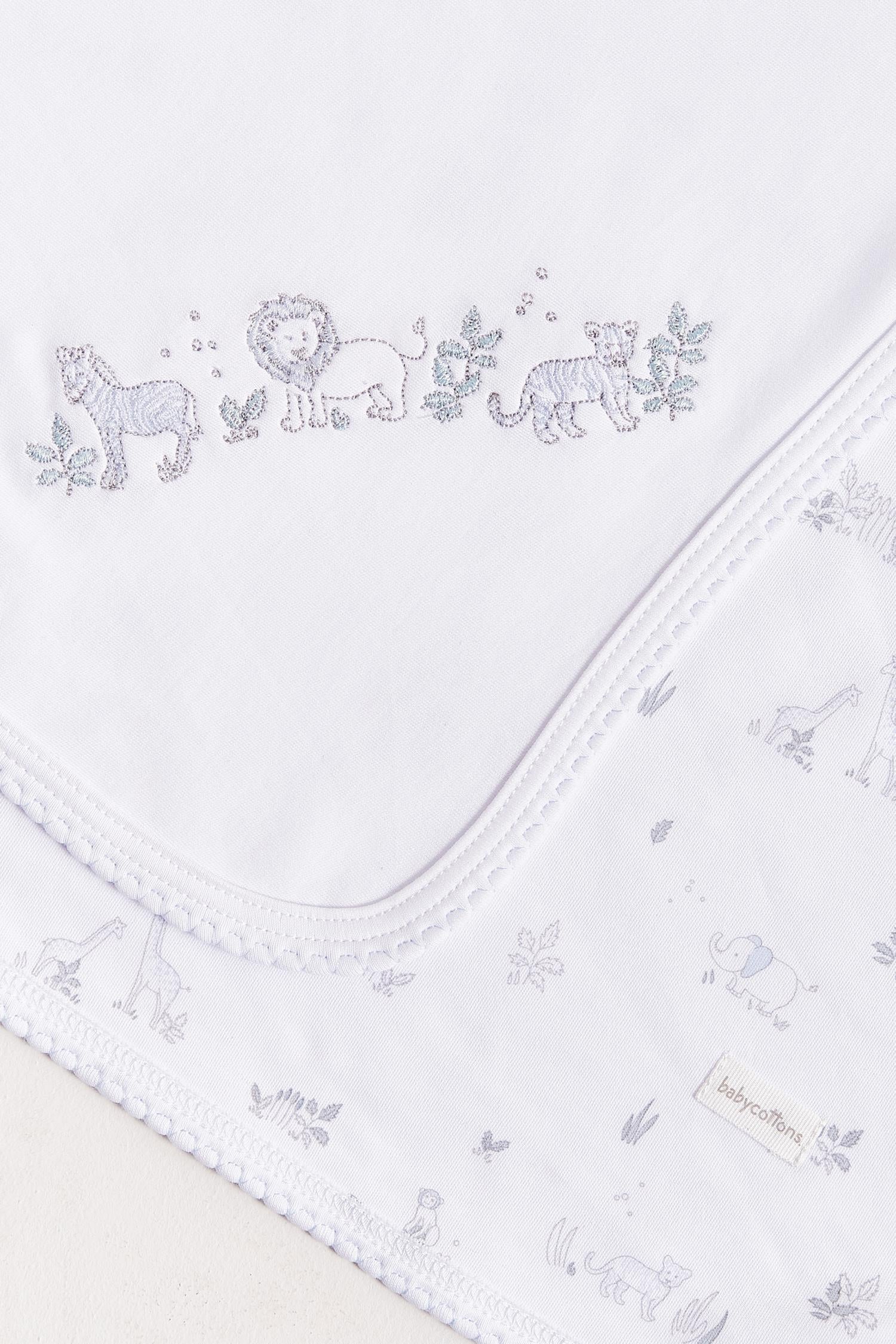 Crafted from super soft cotton, this receiving blanket makes babies first months extra cozy.  This two sided blanket features a sleek white finish with embroidered jungle animals, while the order side comes with a full print of our Mini Safari collection.  Approximate measurements: 100 cm x 100 cm Composition: 100% Pima Cotton.  Made in Peru.  Machine washable. 