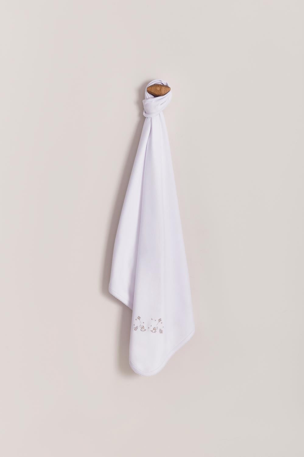 Crafted from super soft Pima cotton, this receiving blanket makes babies first months extra cozy.  This two sided blanket features a sleek white finish with embroidered stars, while the other side comes with a full print of our Night Stars collection. Approximate measures: 73 cm x 69 cm Composition: 100% Peruvian Pima Cotton.  Made in Peru.  Machine washable.  