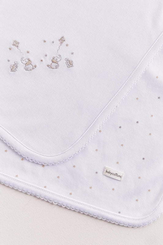Crafted from super soft Pima cotton, this receiving blanket makes babies first months extra cozy.  This two sided blanket features a sleek white finish with embroidered stars, while the other side comes with a full print of our Night Stars collection. Approximate measures: 73 cm x 69 cm Composition: 100% Peruvian Pima Cotton.  Made in Peru.  Machine washable.  